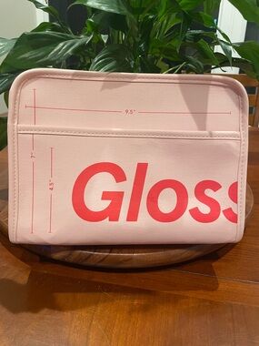 Glossier Pink Beauty Bag. Zip closure, red removable felt insert. 9.5” X 7”